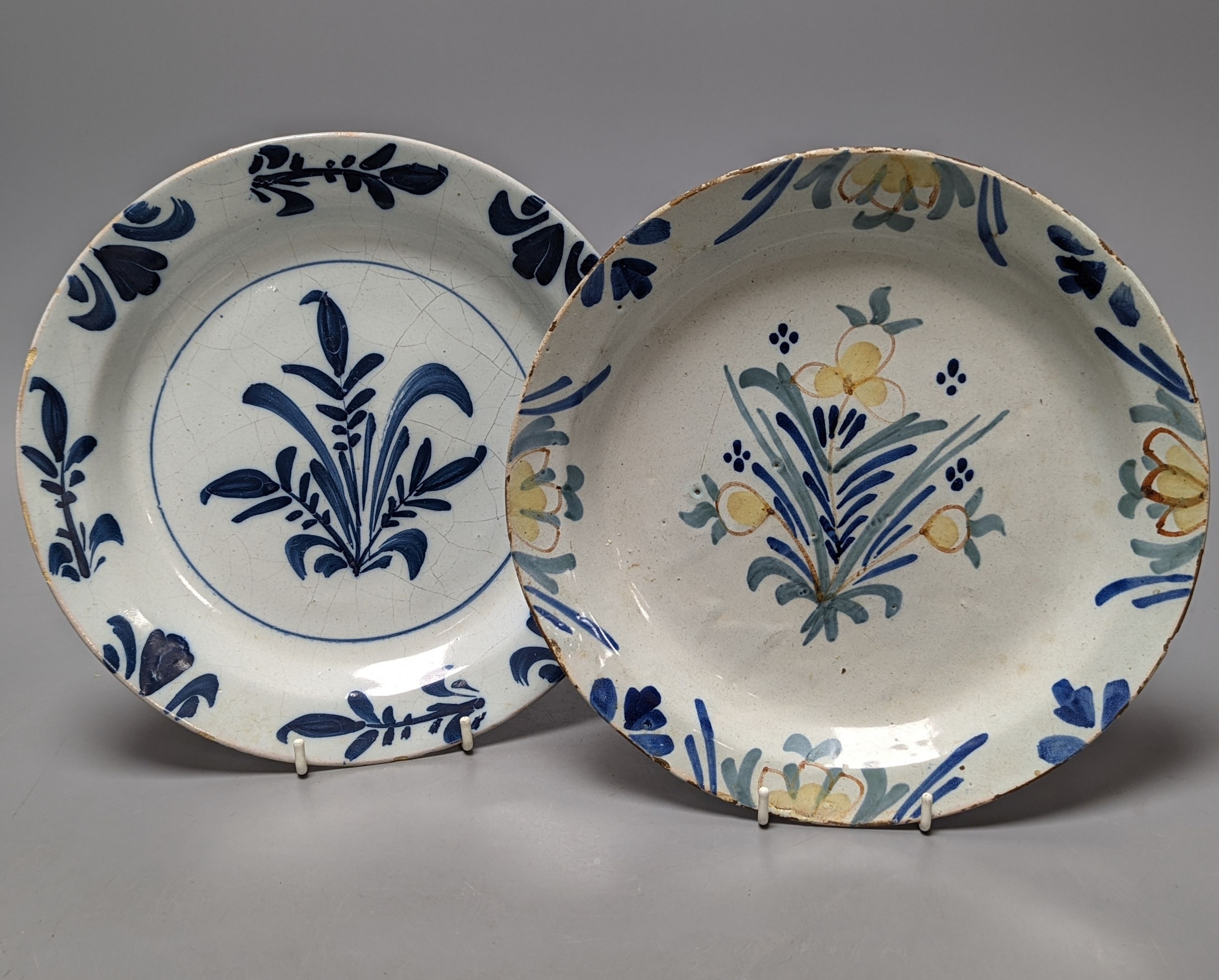 Seven English and Dutch delftware plates and dishes, c.1700-1760, 22 - 23cm, some damage
